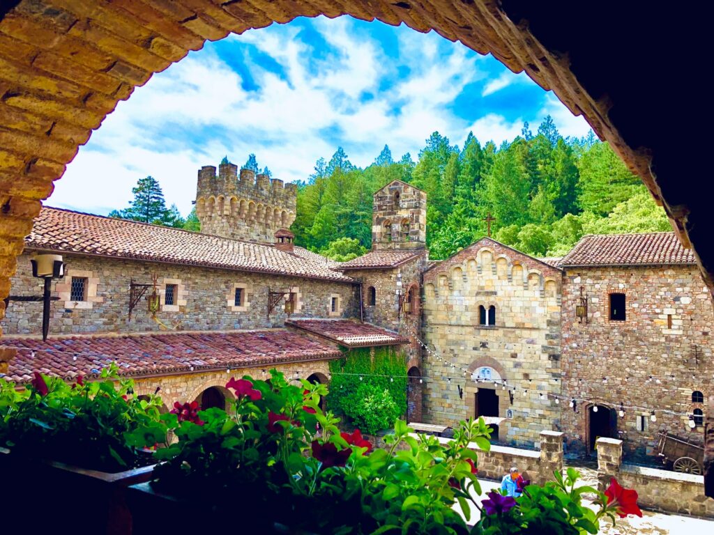 Castello di Amorosa Winery brown brick building under blue sky during daytime